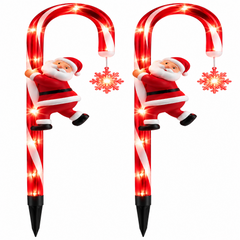 Deux cannes à sucre lumineuses rouges présentent une décoration festive de Noël.